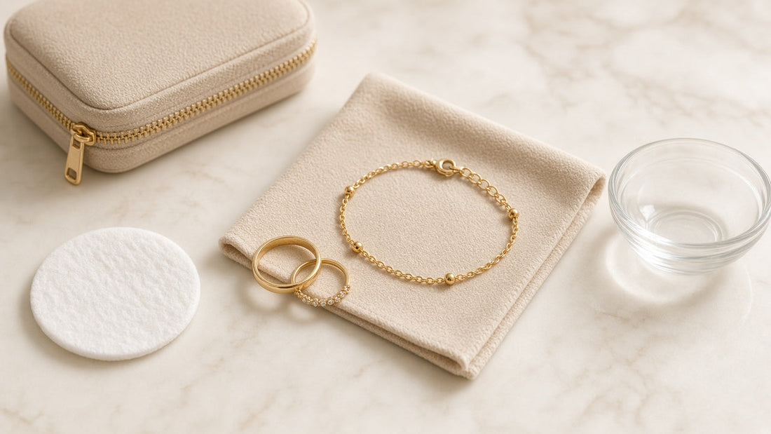 Gold bracelet and rings on a polishing cloth