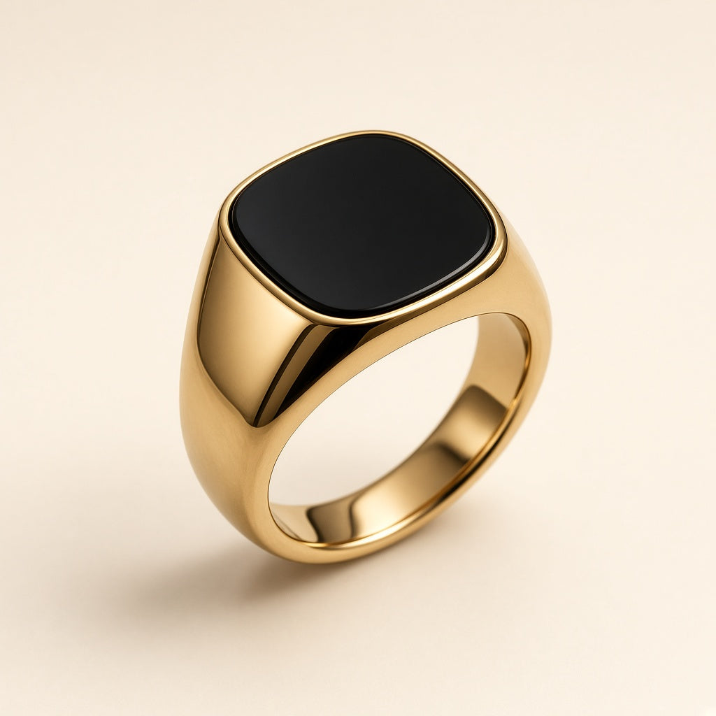 Men's gold-tone signet ring with a flat black onyx face