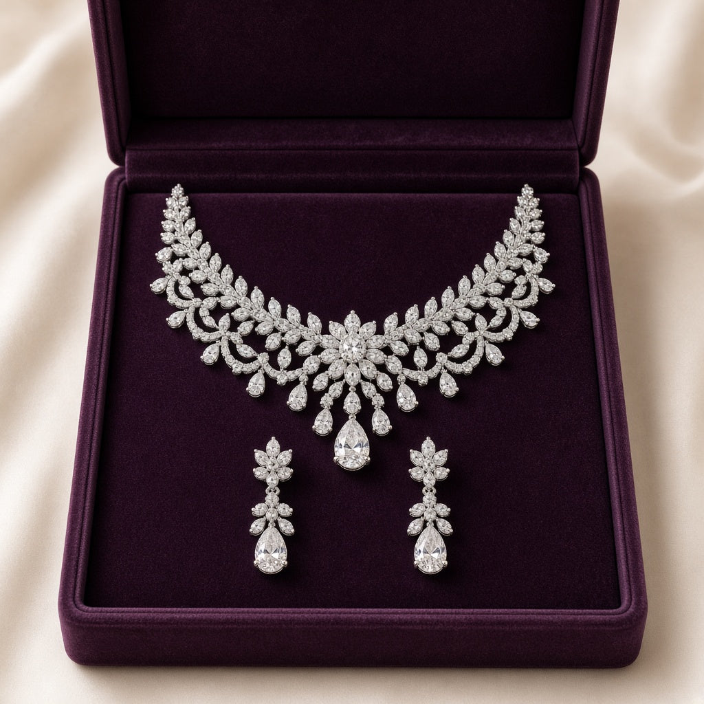 Silver zircon statement necklace and earrings in a plum case