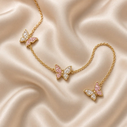 Gold chain bracelet with pink crystal butterfly charms
