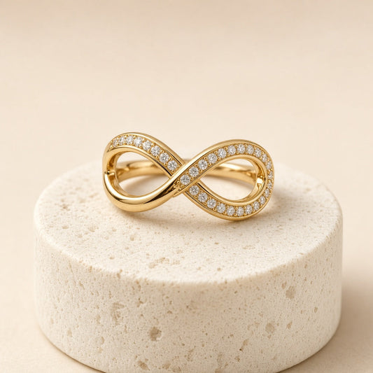 Gold plated infinity twist ring with crystal pave band