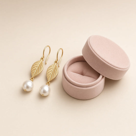 Gold leaf drop earrings with freshwater pearls and a small box