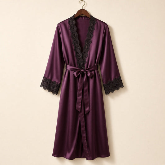 Plum satin robe with black lace trim on a wooden hanger