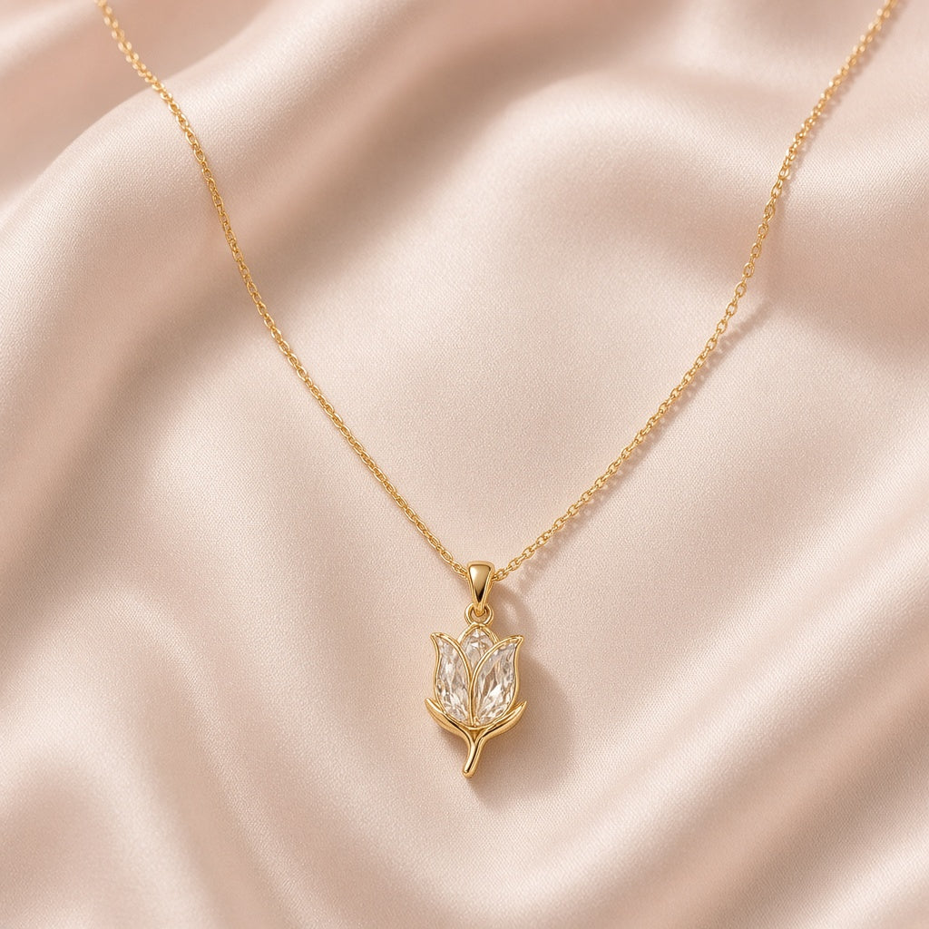 Gold tulip pendant with crystal petals on blush silk