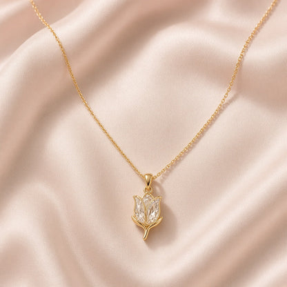 Gold tulip pendant with crystal petals on blush silk